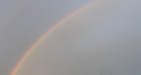 Soft rainbow in the sky after the storm.