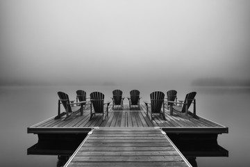 Adirondack deck chairs on lake dock