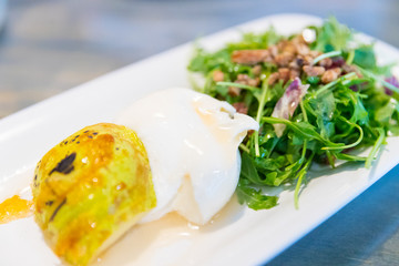 Classic salad with pear, arugula or rocket leaves, shaved parmesan, and walnuts. Drizzled with olive oil. lemon vinegar, burrata,spiced,macadamia.