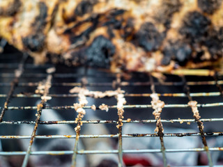Obraz premium Skin of fish grilled on hot charcoal until black and scorched