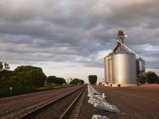 Grain Elevator By The Train Tracks