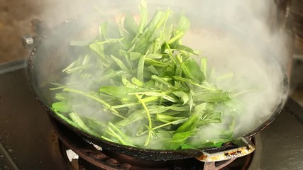 Frying morning  glory in pan, Thai famous food