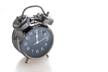 Vintage alarm clock isolated on white background.
