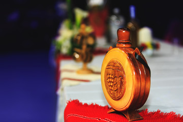 Wooden bottle with national symbols graven on wood (traditional Romanian and Moldavian flask). Vine...