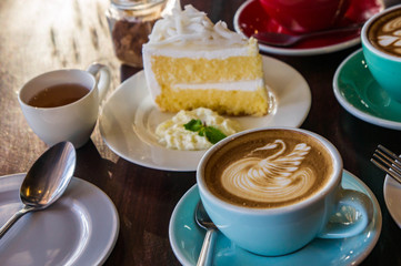 coffee time in the wood table cafe , drink coffee and tasty cake