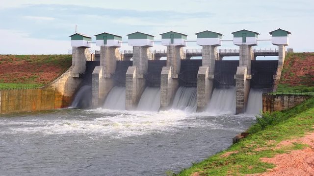 Beautiful view of Meheragala reservoir dam illuminated by sun. Impressive water barrier construction represented on Sri Lankan 5000 rupee banknote. Camera stay still, Yala National Park, Sri Lanka.