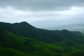 Lush green monsoon nature landscape mountains, hills, farming plot, Purandar, Pune, Maharashtra, India 