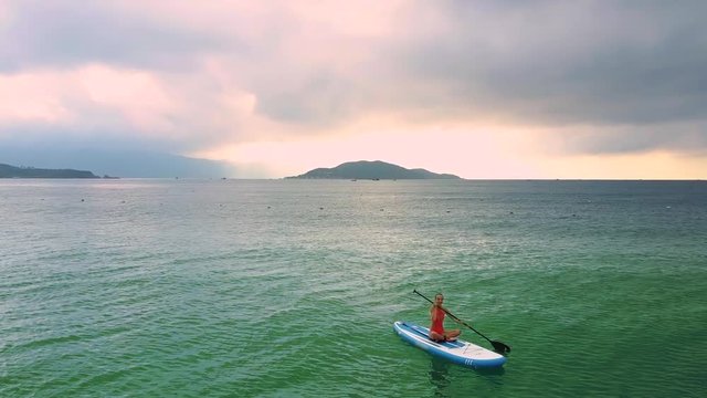 lady on paddleboard disappears in ocean and buoy appears