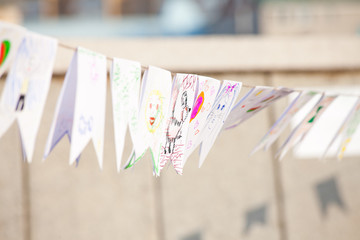 paper flags with children's drawings