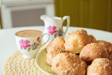 Sesame buns on a white table. Selective focus