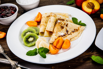 Crepes with fruits and creme 