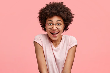 People, emotions and pleasant feelings concept. Beautiful young African American female with joyful...