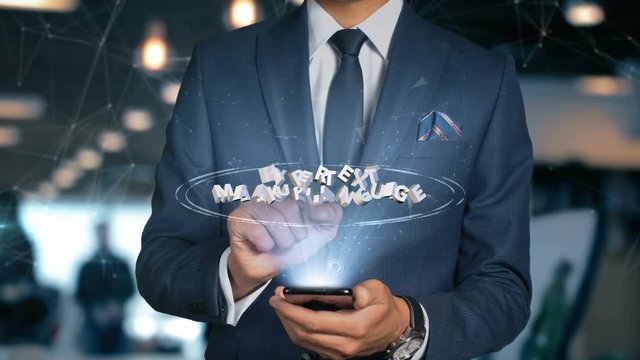 Businessman With Mobile Phone Opens Hologram HUD Interface and Touches Word - HYPERTEXT MARKUP LANGUAGE