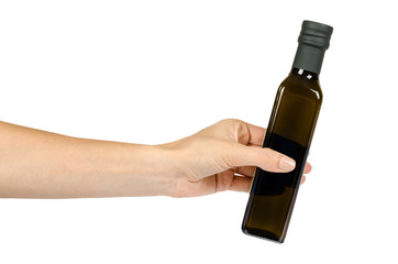 Green bottle of olive oil with hand, isolated on a white background