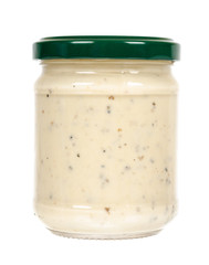 Creamy sauce with truffle for pasta in glass jar isolated on white background