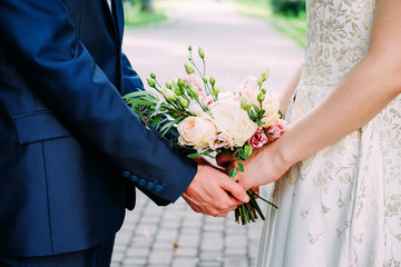 Husband and wife getting married and holding hands