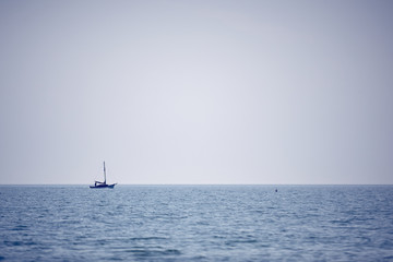 Boat on the sea travelling across the ocean background