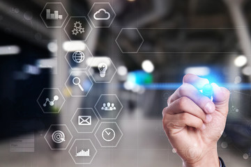 Business and technology concept. Graphs and icons on virtual screen.