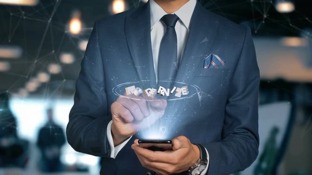 Businessman With Mobile Phone Opens Hologram HUD Interface and Touches Word - MODERNIZE