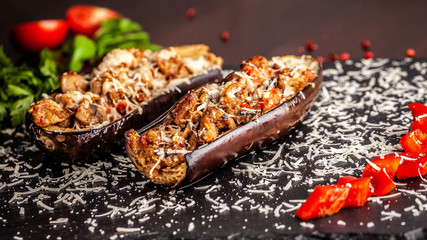 Portuguese cuisine. Baked eggplants with mushrooms, meat, vegetables and parmesan cheese. Copy space, selective focus