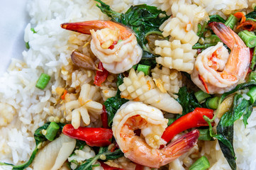Fried basil shrimp with squid topped with rice