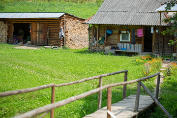 Fototapeta na wymiar Old wooden rural house in a mountainous area in the Carpathians.