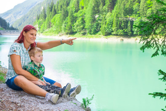 Mom Andson  Look At Something On The Horizon During An Excursion To The Lake