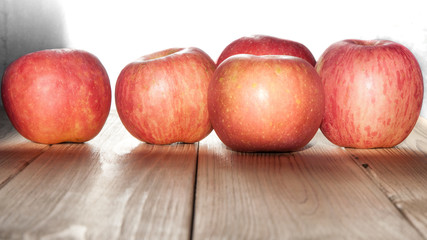 Ripe apples on a wooden table