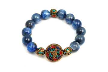 Kyanite or Cyanite blue lucky stone bracelet bead decorate with Chakra amulet accessories on white isolated background
