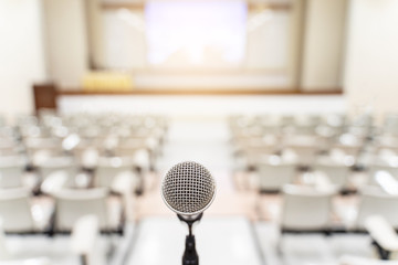 Microphone over the blurred business forum Meeting or Conference Training Learning Coaching Room Concept, Blurred background
