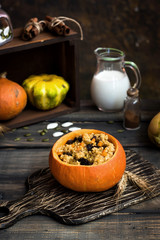 Millet porridge with raisins in pumpkin