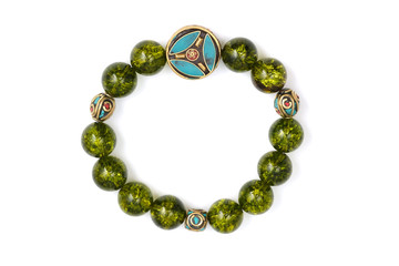 Peridot bracelet Beads green ore lucky stone decorate whit Chakra amulet white white isolated background
