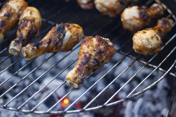 Grillled chicken drumsticks on the open grill