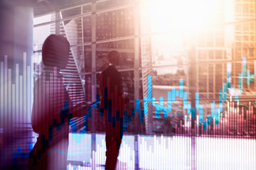 Stock trading candlestick chart and diagrams on blurred office center background.