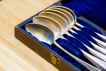 An old historic case with blue satin to place silverware spoons inside and keep them stored savely....