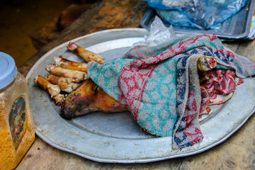 Dog meat on a plate,ready to eat in Vietnam, South East Asia. Dog is a typical and traditional dish served for reunions with families you haven´t seen for a long time. 