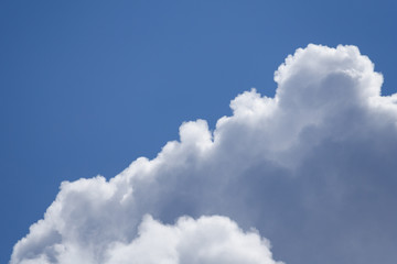 Obraz premium Gray fluffy clouds in the blue sky