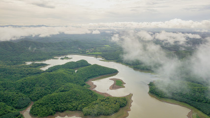 Fototapeta premium Mist across lake and mountain in the nature of Thailand