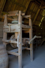 Fototapeta na wymiar Ancient wooden millstone 