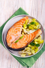 Roasted salmon steak with salad