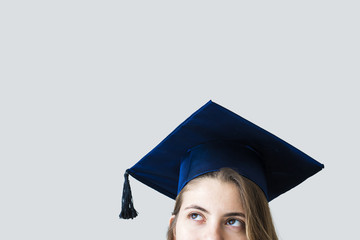 Young female student graduating from university