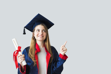 Young female student graduating from university