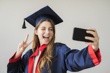 Young female student graduating from university
