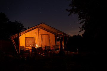 Tent at night with long exposure of stars 