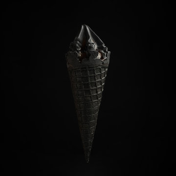 black ice cream on a black background.Style and summer mood