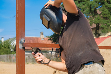 the welder welds metal structures