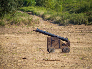 medieval cannon on battle field ready to shoot