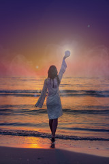 Fototapeta na wymiar fantasy image of a beautiful woman at sea shore during dawn raising moon