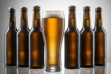 Glass and bottles of beer