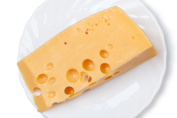 Piece of cheese on a white plate